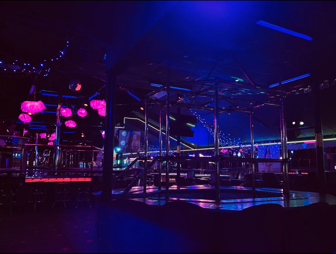 A sophisticated, dimly lit lounge with private seating